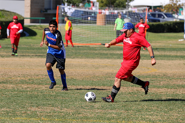 Special Olympics athletes playing soccer at 2023 Fall Games