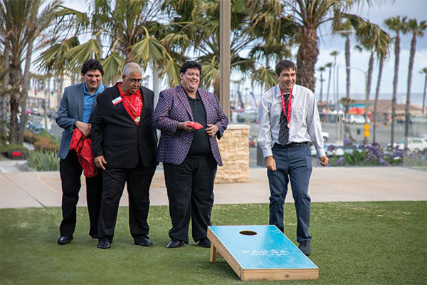 2025 Heart of a Champion athlete attendees playing cornhole