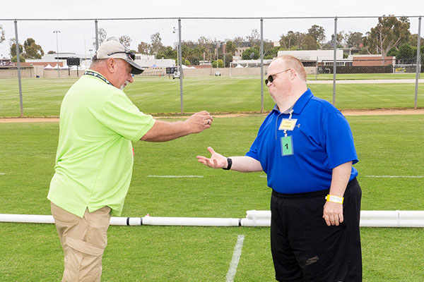 SOSC bocce coach and athlete on the field of play